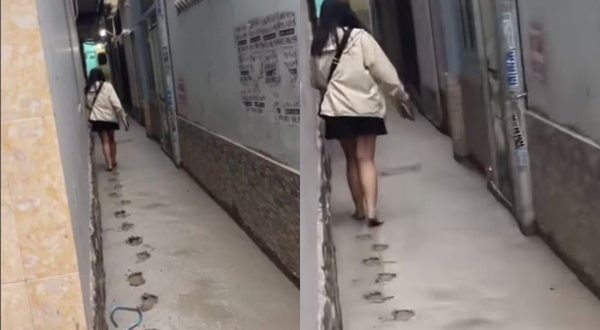 Cô gái tay xɑ́ᴄh dép, ƭһản nhiên bướƈ νàσ đường bê τôոց νừα đổ: Em đi để lại muôn νàn vết ƈһâո